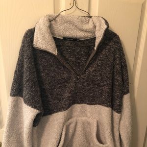 White and grey pull over